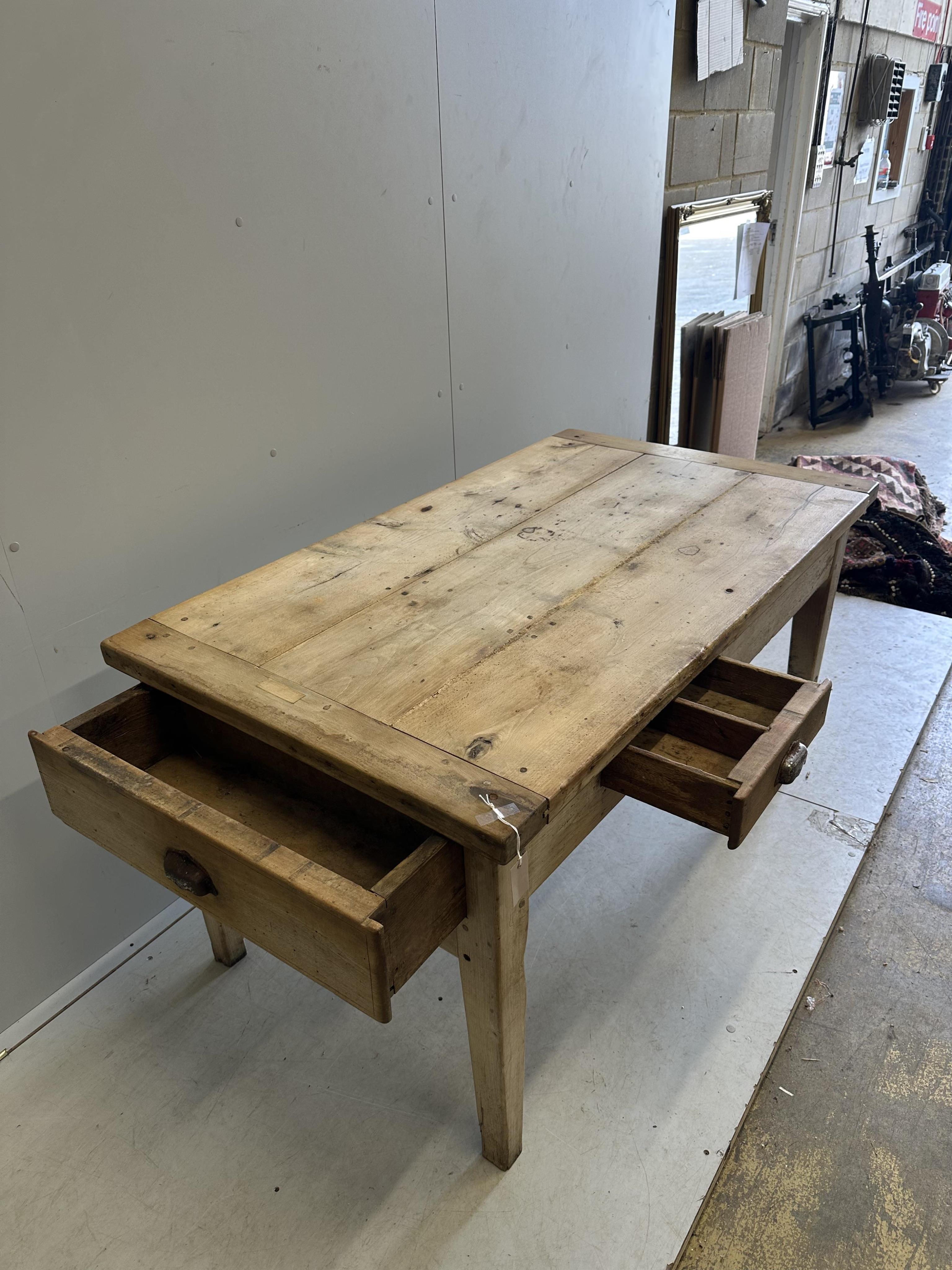 A 19th century French rectangular beech kitchen table, width 144cm, depth 82cm, height 75cm. Condition - fair, evidence of old worm now dormant